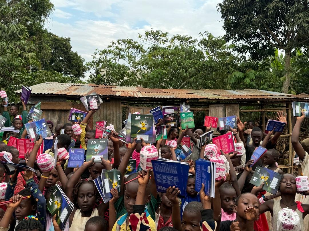 Nansana Dance Kids children with school supplies in Uganda